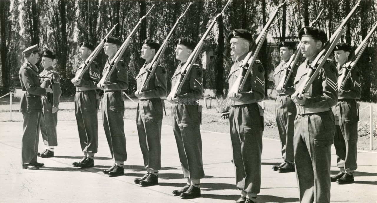 Major General L H Howard-Jones, CBE inspecting the Quarter Guard at REME Workshop, Berlin