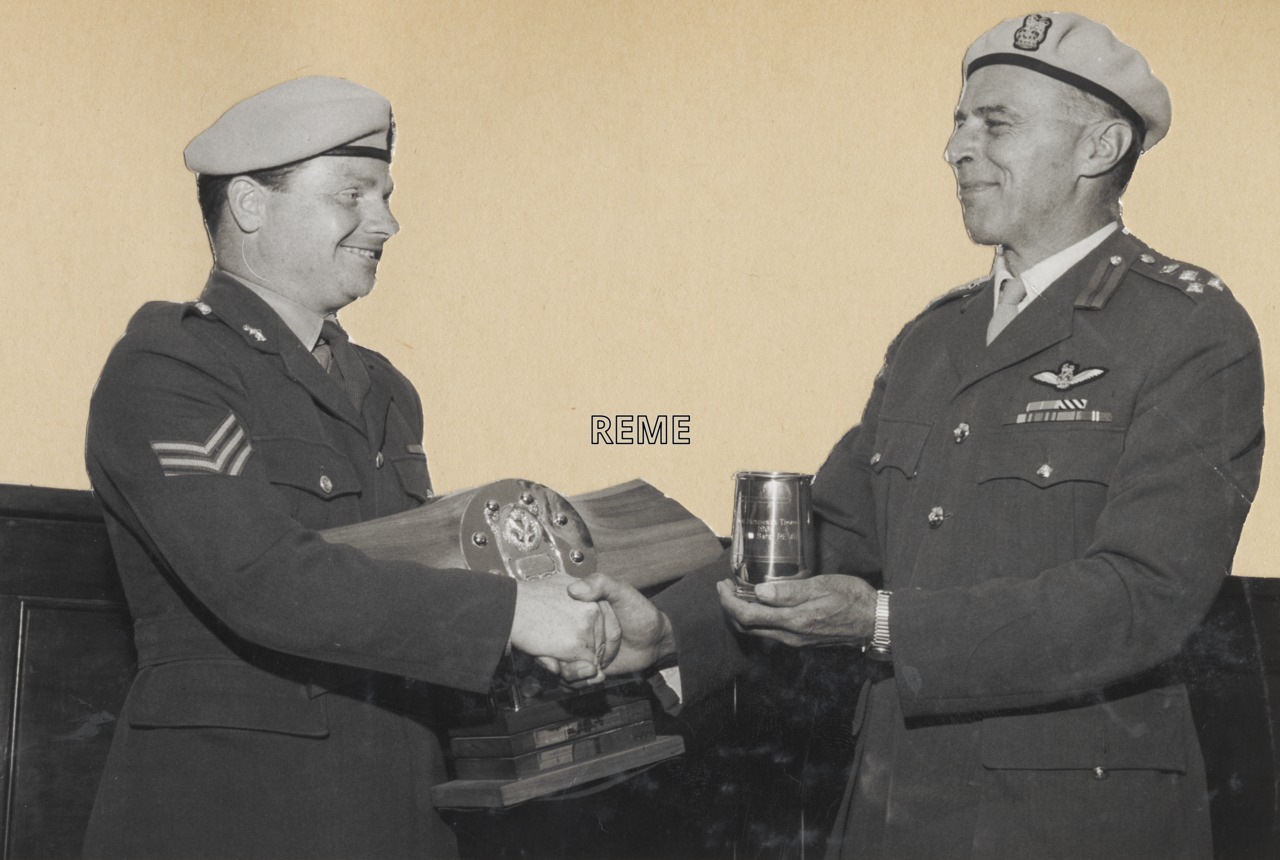 Brigadier D W Coyle presents the Hutchings Trophy for flight safety to Sergeant W Batey, 70 Aircraft Workshop, August 1969.